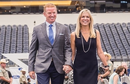 Jason Garrett and his wife Brill Garrett walking at the Dallas Cowboys stadium